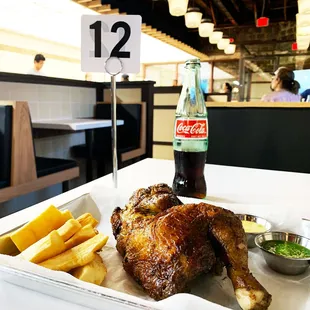 a chicken and french fries on a table