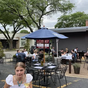a woman holding a glass of wine