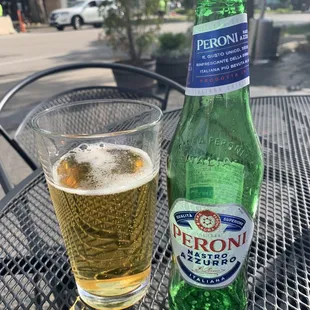 a beer and a glass on a table