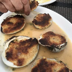 Fantastic baked clams the sauce on the plate was bread soaking amazing next time I'm getting my own dozen
