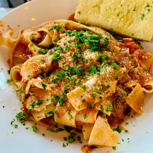 a plate of pasta and bread