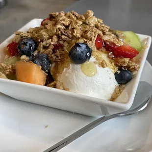 a bowl of fruit and yogurt