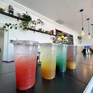 ows a row of drinks on a counter