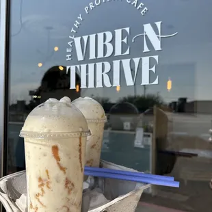 ows a person holding a cup of iced coffee
