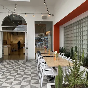 a patio with a table and chairs