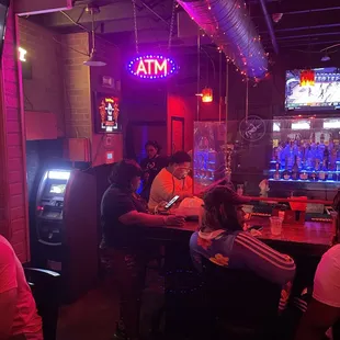 people sitting at a bar