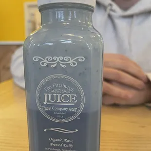 a bottle of juice on a table