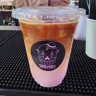 a cup of iced coffee on a table