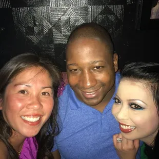 three people posing for a picture