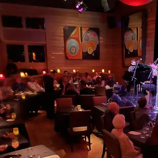 These two exact same size tables next to ours sat empty, while we sat in front of the horns and drums.