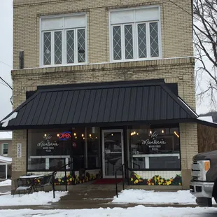 Store front, with plenty of street parking.
