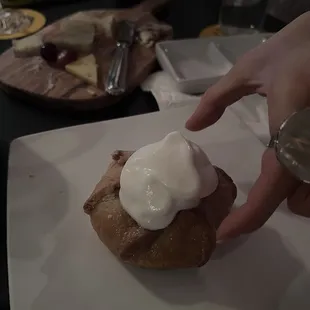 apple crumble with cheese plate in the background