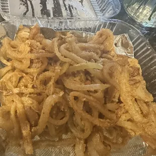 Greasy onion rings. You can&apos;t even pick them up to dip. These are just sautéed onions.