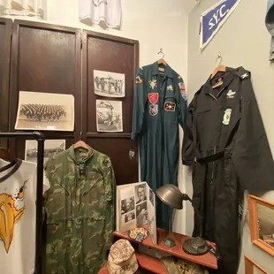 The back room has extra treasures like these pilot uniforms.