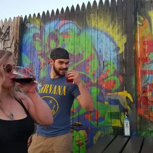 a man and a woman drinking wine