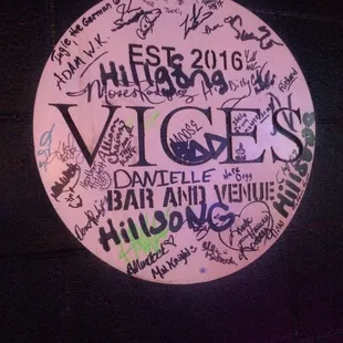 a circular sign covered in graffiti