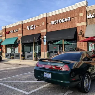 Outside. Storefront and patio. Located in the Hope Valley Commons shopping center.