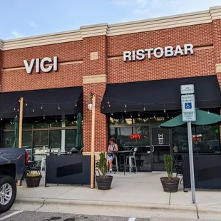 Outside. Storefront. Patio. Located in the Hope Valley Commons shopping center with Harris Teeter (but different side of shopping center).