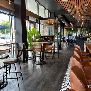 a view of a restaurant with tables and chairs