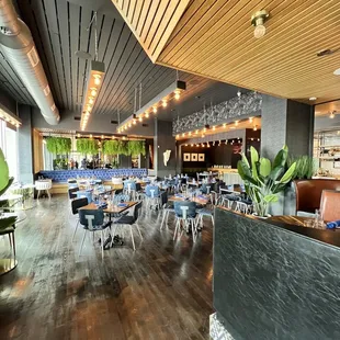 a dining area with tables and chairs