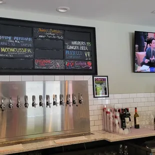 a bar with a menu on the wall