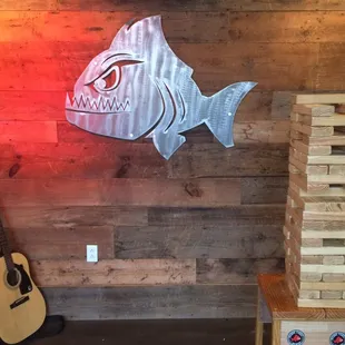 a neon fish on the wall