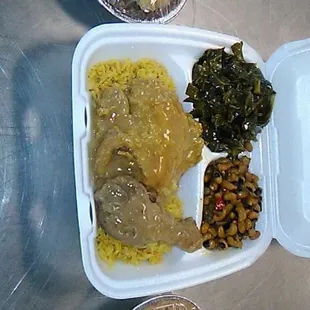 Smothered chicken with black eye pea and greens