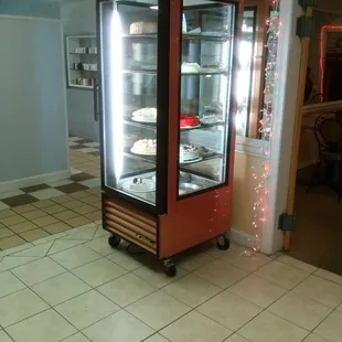 a display case with cakes in it