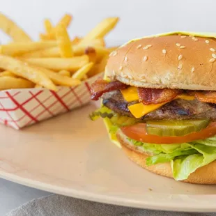 Bacon burger made with a juicy beef patty , crispy smoky bacon slices, fresh lettuce, onion, tomato pickles and 1000 island.
