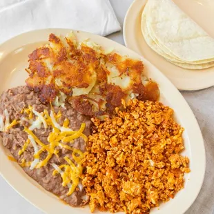 Introducing our Chorizo and Eggs Breakfast, a savory morning delight bursting with flavor.