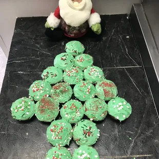 a pile of green frosted christmas cookies