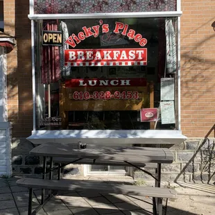 a picnic table outside of a restaurant