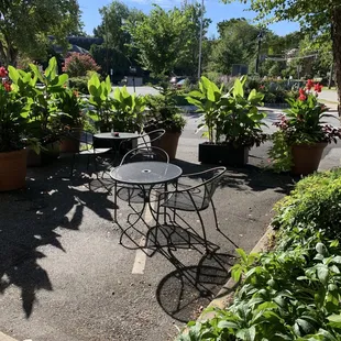 a patio with tables and chairs