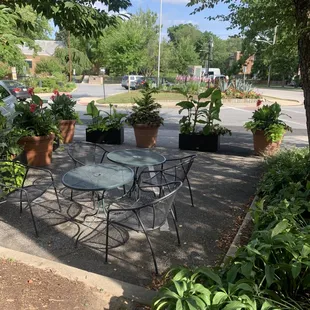 a patio with a table and chairs