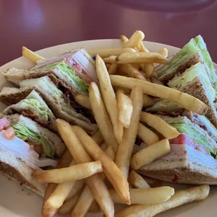 Chicken Breast Club Sandwich with fries