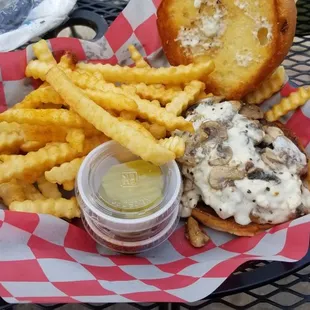 Burger tasted better than it looks here but fries were cold and patty was well overcooked.