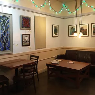 Cute ambiance with original art on display.
