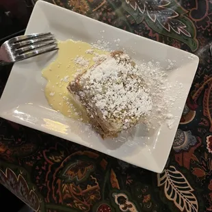 a piece of cake on a plate with a fork