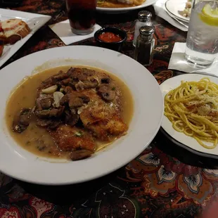 Chicken Tosca, garlic toast with tomato and mozzarella...side of pasta with oil and garlic!!!