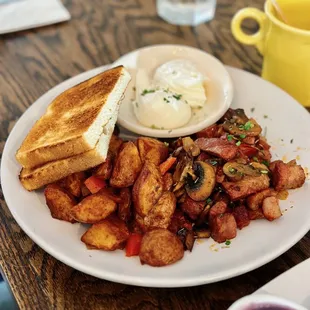 Corned Beef Hash, side of breakfast potatoes, poached eggs and sourdough toast