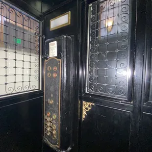 Period elevator inside the The Victor Hotel.