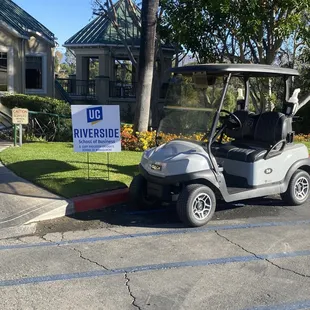 a golf cart parked in a parking lot