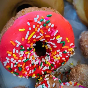 a variety of donuts with sprinkles
