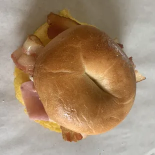 Bagel egg, ham, bacon and cheese.