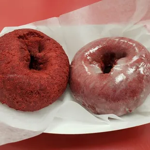 a red velvet donut and a chocolate donut