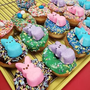a tray of decorated easter donuts