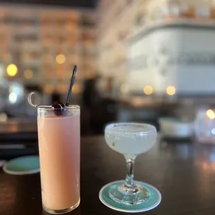 two cocktails on a table in a restaurant