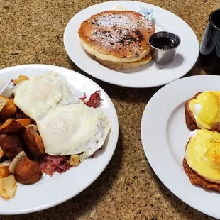 Chocolate chip pancakes, corned beef hash plate (hash is under the eggs) and latke eggs benedict