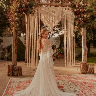 Paige, gown, flowers display at alter