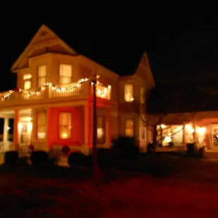 a red house with christmas lights